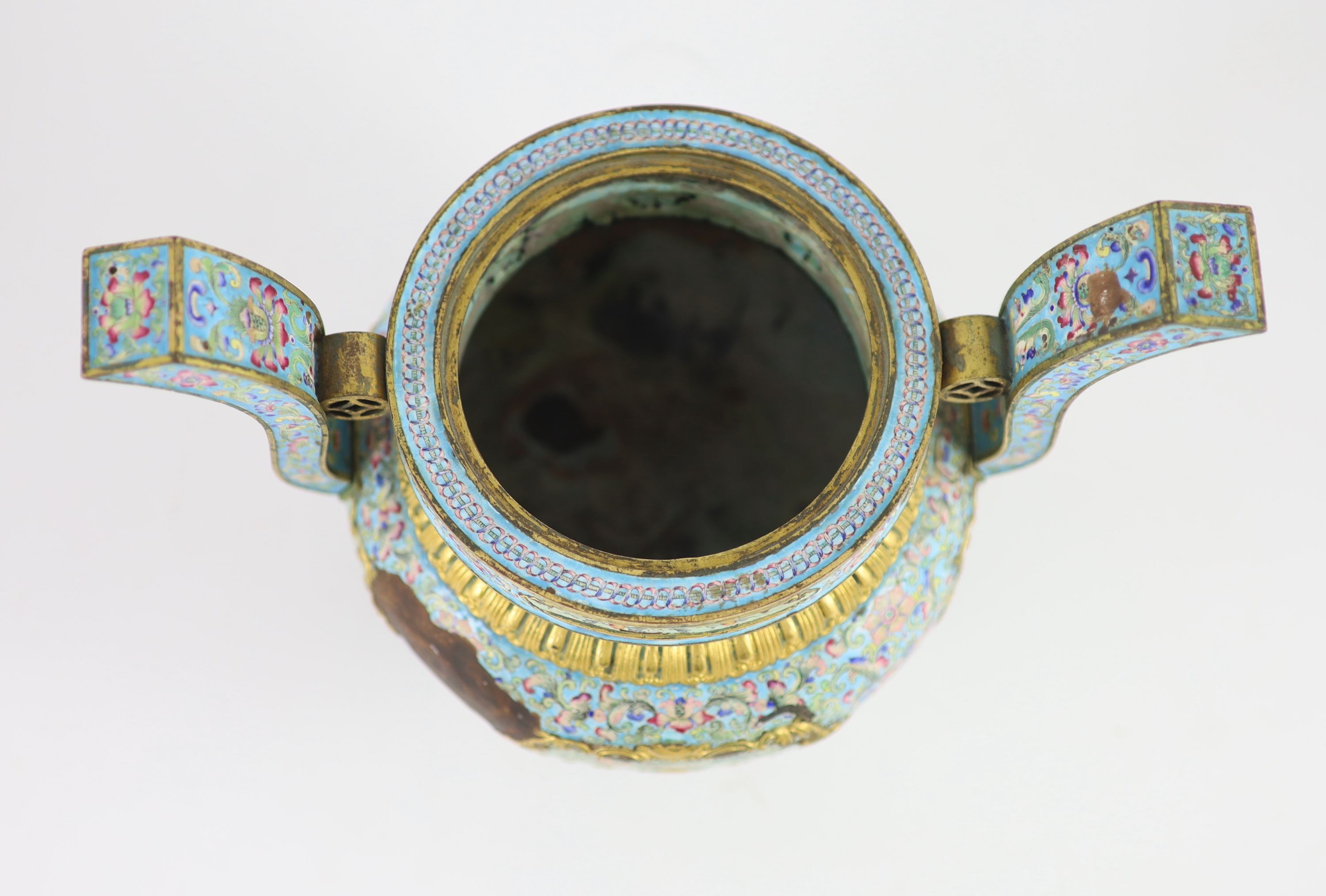 A Chinese Canton enamel tripod censer, Qianlong mark and period (1736-95), 22.5 cm high, 26 cm wide, losses to enamels